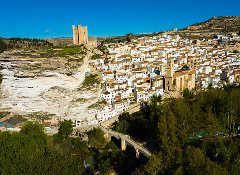 Aerial view of ancient stone town Alcala del Jucar, Spain