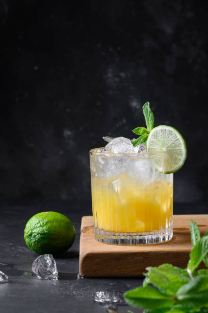 istock Mai Tai Classic rum cocktail. Tropical lemonade with lime on black. 1309138478