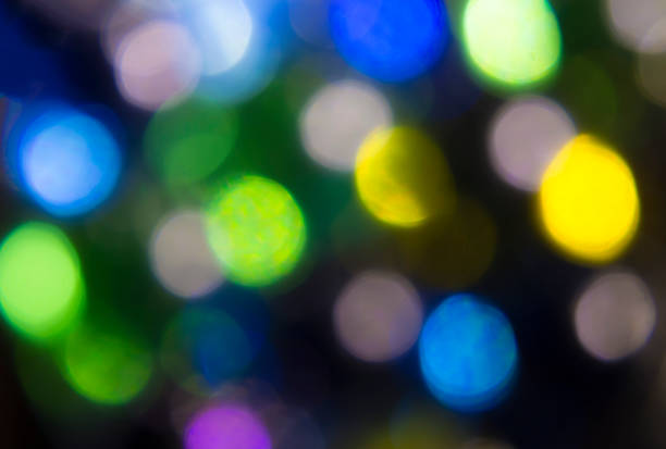 istock Colorful bokeh background, lights out of focus 1309140497