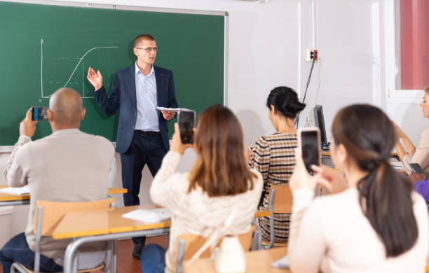 istock Teacher at the slate explains the lesson to student 1309140703
