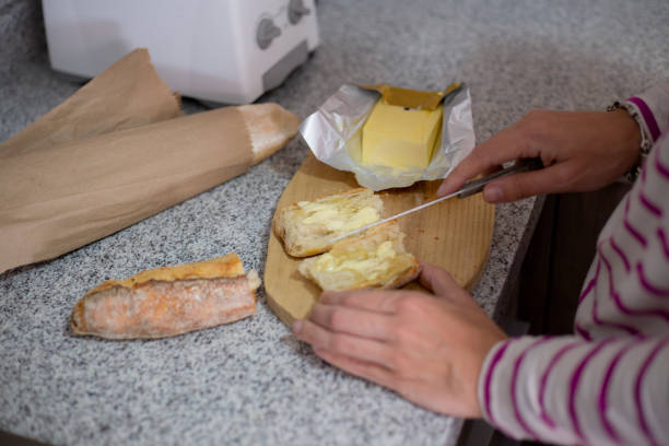 istock woman making bread with butter 1309141593