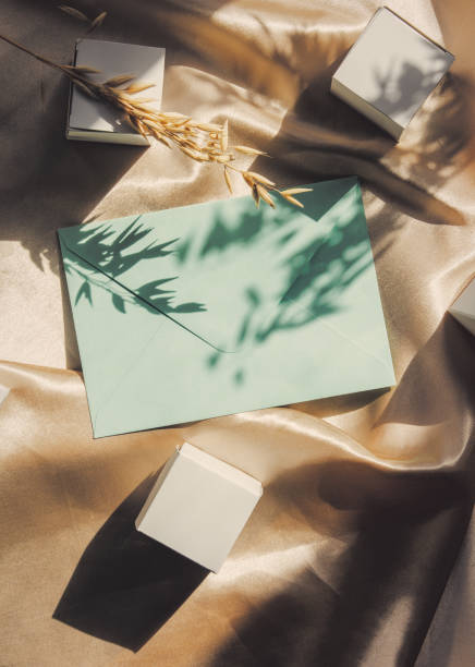 istock Classic envelopes and cubes on golden fabric with shadows 1309142842