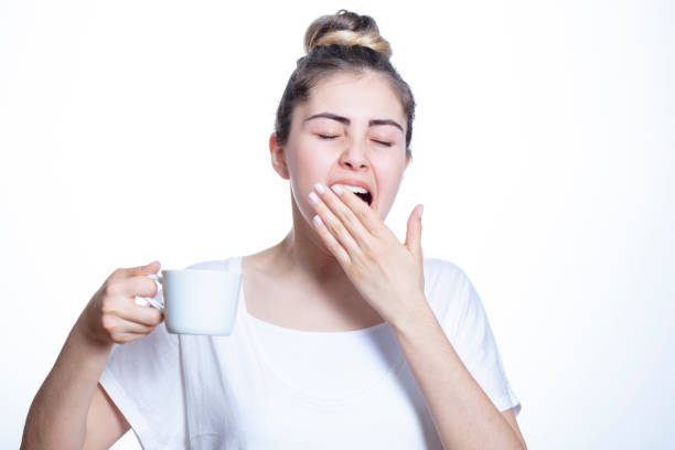 istock young beautiful woman drinking coffee to wake up 1309144294