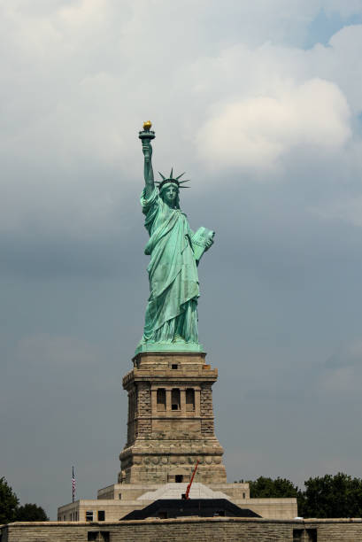 istock The Statue of Liberty on a Partly Cloudy Summer Day 1309144976