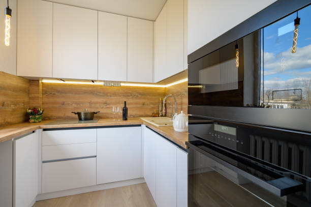 istock Modern white and beige wooden kitchen interior 1309147682
