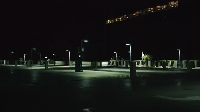 Empty parking lot at night.