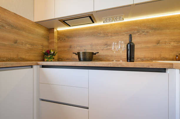 istock Modern white and beige wooden kitchen interior details 1309149555
