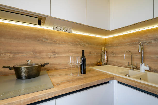 istock Modern white and beige wooden kitchen interior details 1309149597