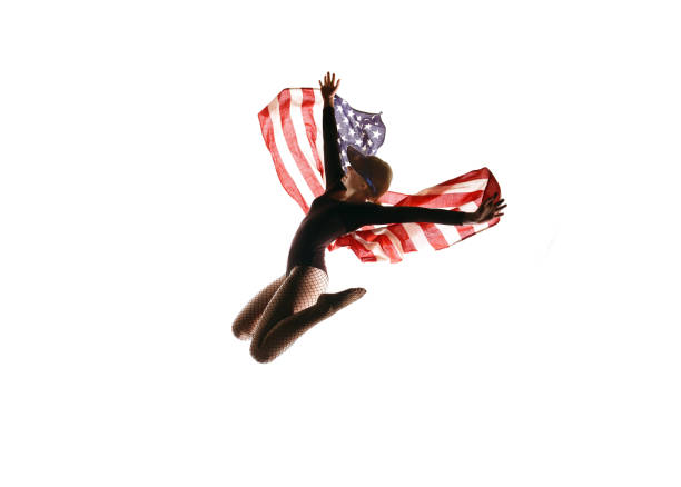 istock Patriotic Dancer Jumping Up High With A USA Flag 1309149911