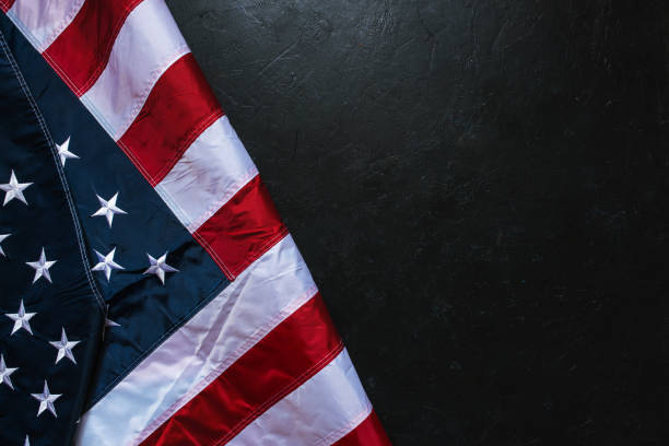istock USA Flag on dark background 1309150773
