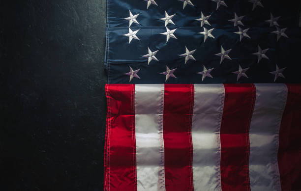 istock USA Flag on dark background 1309150785
