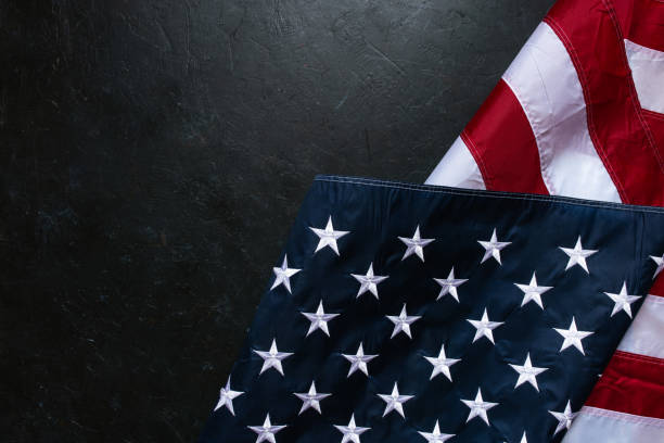 istock USA Flag on dark background 1309150792