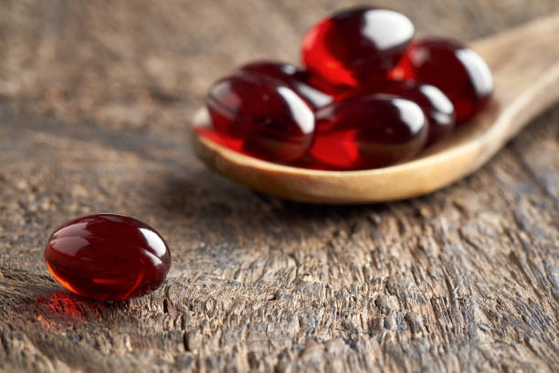 istock Krill oil capsules on a table 1309150867