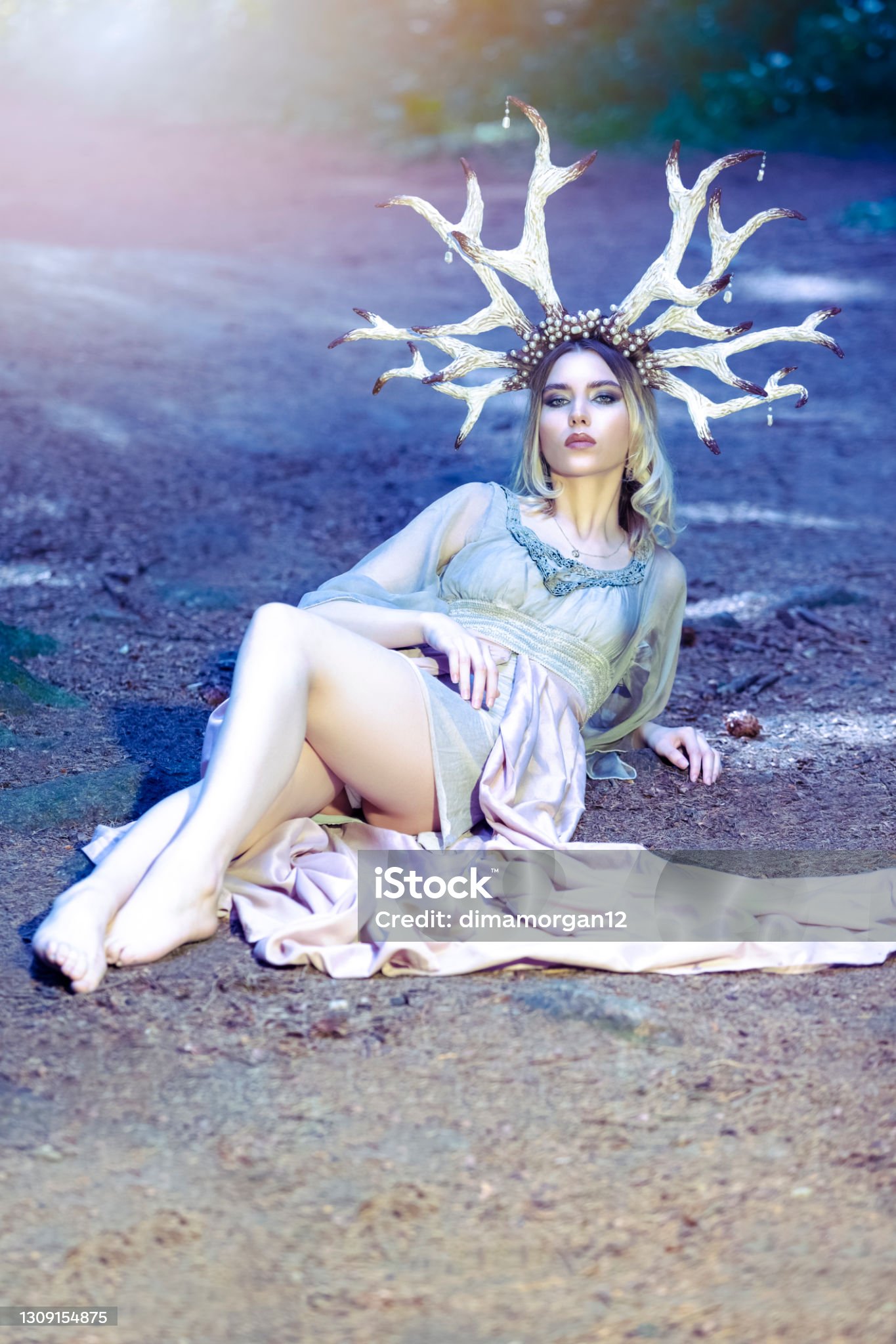 https://media.istockphoto.com/id/1309154875/photo/portrait-of-beautiful-girl-posing-with-artistic-deer-horns-in-summer-forest-on-sandy-forest.jpg?s=2048x2048&amp;w=is&amp;k=20&amp;c=SGkTl4nkUATwGv4xKm7WAt3I765fUEAPCMFpxd_XFwI=