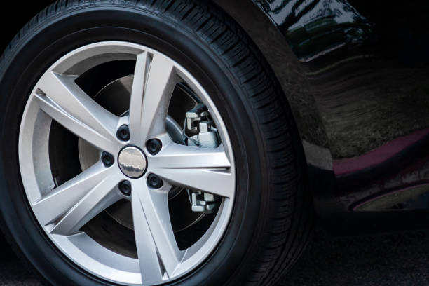 istock car wheel on a black background 1309155782
