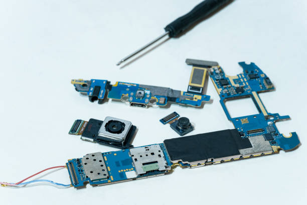 istock Smartphone component parts,camera chip and printed circuit motherboard,tech 1309159015