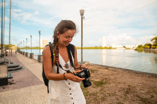 istock Journalist photographer adjusting camera in Recife, Pernambuco 1309159994