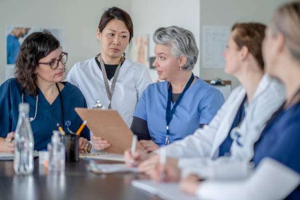 istock Female Doctors and Nurses in a Meeting 1309166394
