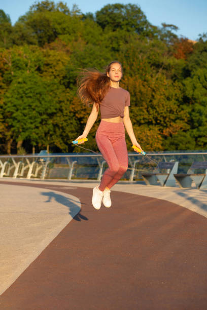 istock ginger woman doing workout with a skipping rope 1309166614