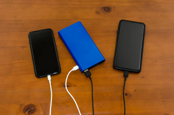 istock Charge sharing- recharging two cellphones with one power bank 1309167321