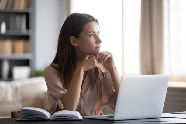 istock Close up thoughtful woman looking to aside, pondering project strategy 1309167640