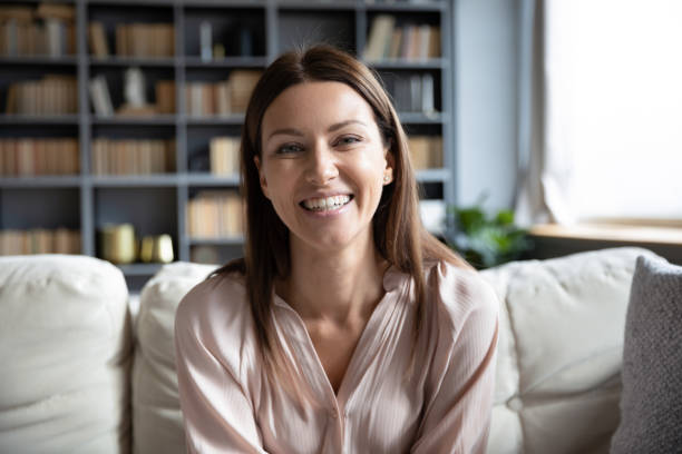 istock Head shot portrait smiling woman making video call, using webcam 1309167682