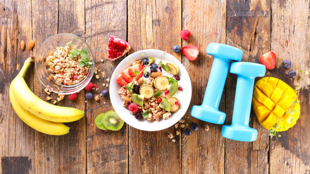 istock diet food concept- breakfast and dumbbell 1309167777