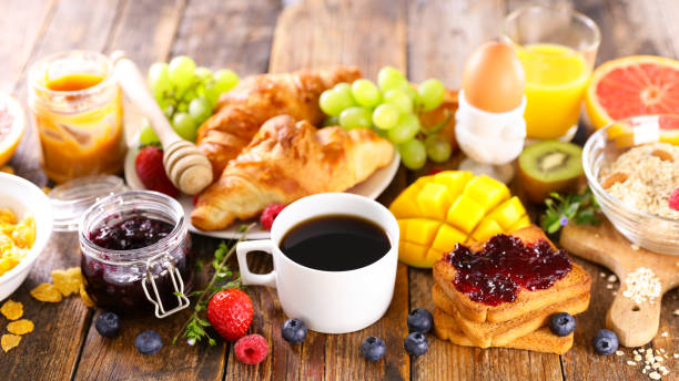 istock continental breakfast- coffee cup,  croissant,  cereal and fruit 1309167782