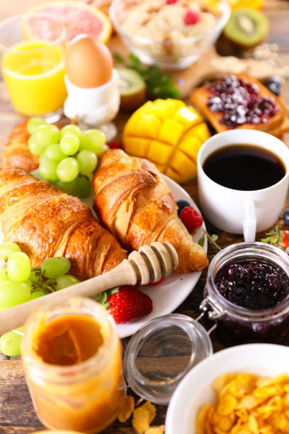 istock Breakfast- coffee cup,  croissant,  cereal and fruit 1309167785