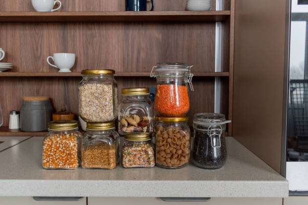 istock Organization space the kitchen. On the table cereals in glass jars 1309169108