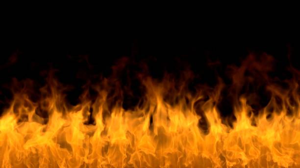 istock Fire flames on black background. Burning fire flame. Beautiful abstract background on the theme of fire, light and life. Fiery orange glowing. Strong fire. Big burning bonfire. Burning fields 1309172072