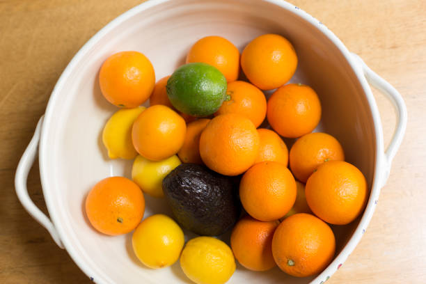 Citrus Fruit in White Ceramic Bowl