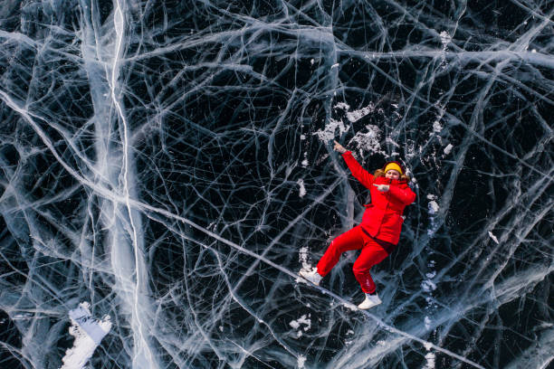 istock woman on  ice  Baikal 1309185325