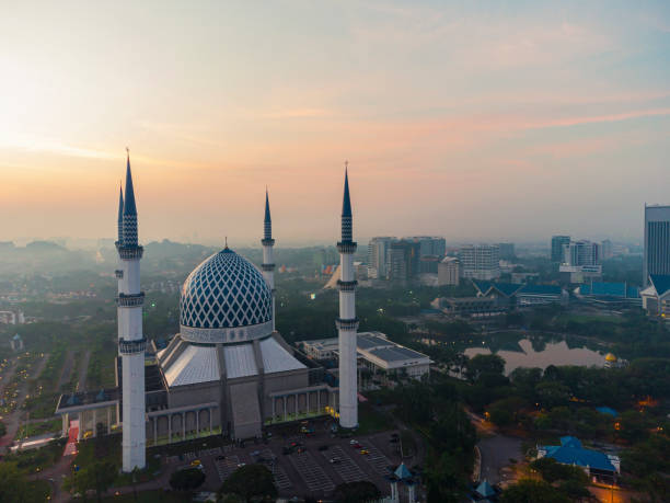 istock Shah Alam Blue Mosque soft light sunrise 1309199599