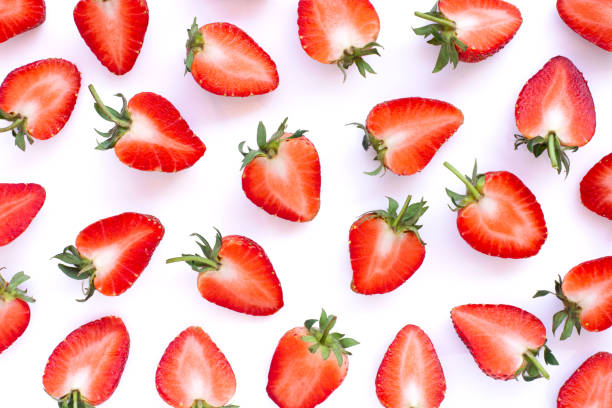 istock Strawberry half sliced isolated on white background. 1309200784