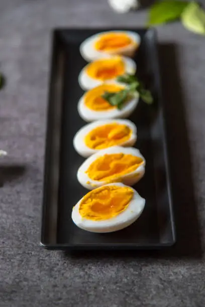 Close up of boiled egg slices with use of selective focus.