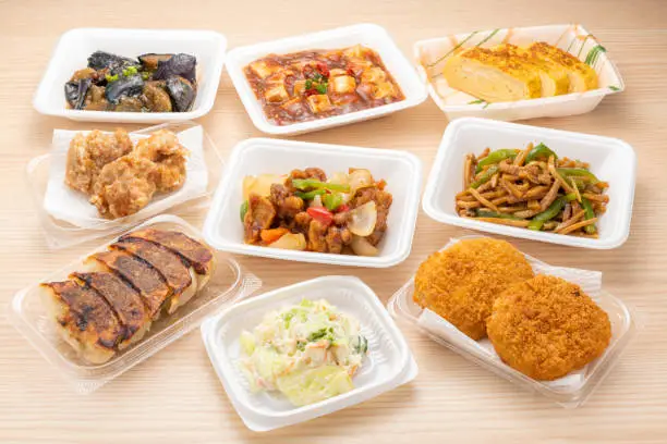 Side dishes in various packs on the table.