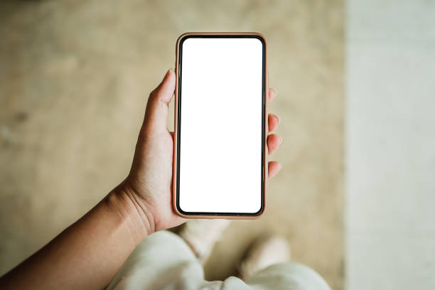 istock Women's hands holding cell telephone blank copy space screen. smart phone with technology concept 1309203989