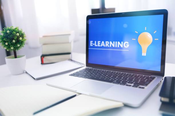 istock E-learning Education Internet Networking . Young businesswoman sitting at table used laptop with inscription on screen e-learning. Online education e-learning. 1309204859