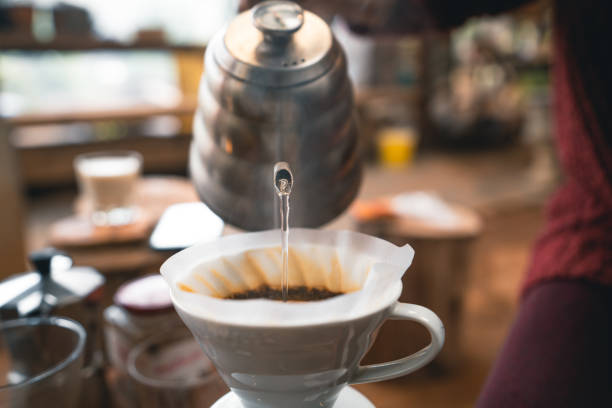 istock Drip coffee hot water from the kettle into the coffee. 1309208975