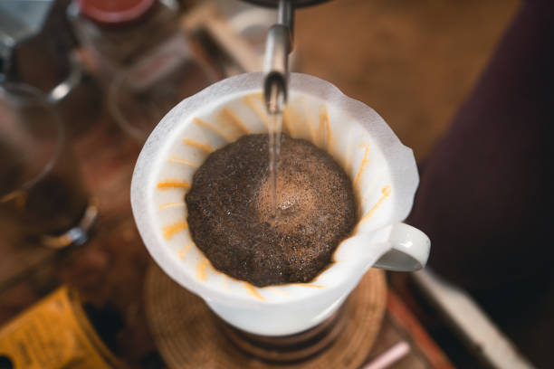 istock Drip coffee hot water from the kettle into the coffee. 1309208977