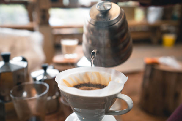 istock Drip coffee hot water from the kettle into the coffee. 1309209000