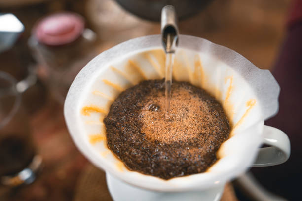 istock Drip coffee hot water from the kettle into the coffee. 1309209010