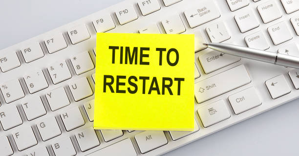 istock Words TIME TO RESTART written on stickers on a computer keyboard 1309209647