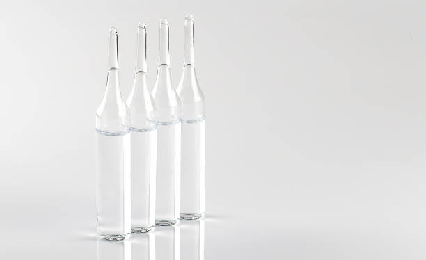 istock glass ampoules on white background, global vaccination concept 1309209664