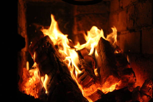 istock Burning Blue Fire and Coals in Chimney Fireplace 1309211627