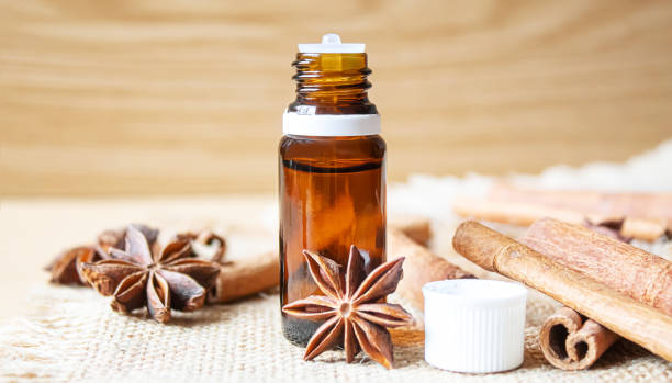istock Star anise and cinnamon oil in a bottle. Selective focus. 1309212010