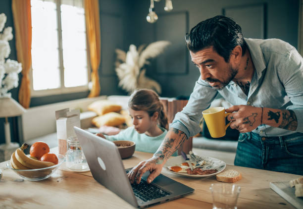 istock a father prepares breakfast for his daughter 1309212844
