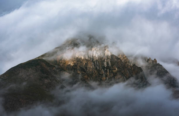istock Cloudy mountains in the early morning 1309212907