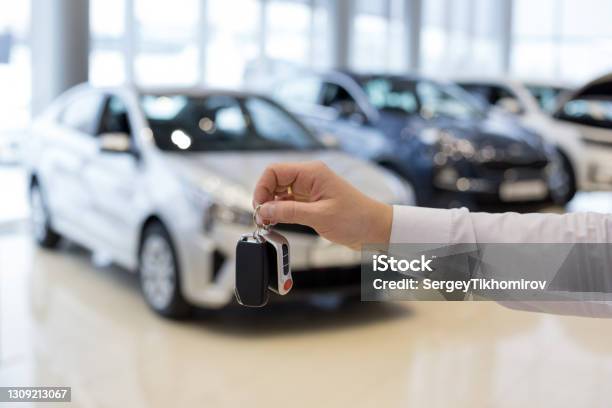 Salesman Holding Keys To A New Car Car Auto Dealership Stock Photo - Download Image Now